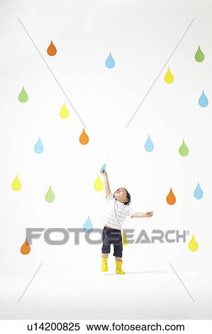 Stock Photography - Boy Catching Raindrop. Fotosearch