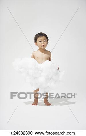 Stock Image - Boy holding a cloud. Fotosearch