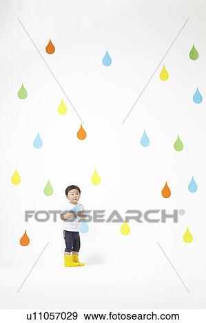 Stock Photo - Boy Holding Raindrop. Fotosearch