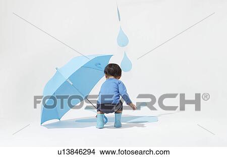 Picture - Boy in Rain. Fotosearch