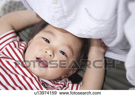 Boy lying on back View Large Photo Image Stock Photo - Boy lying on back. Fotosearch