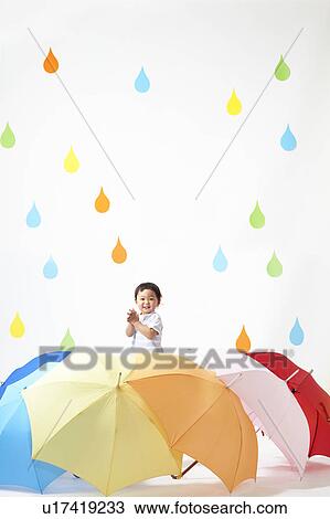 Boy Surrounded by Umbrellas in Rain View Large Photo Image Stock Image - Boy Surrounded by Umbrellas in Rain. Fotosearch