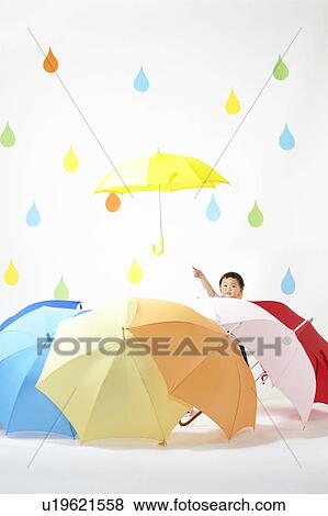 Boy Surrounded by Umbrellas in Rain View Large Photo Image Stock Photo - Boy Surrounded by Umbrellas in Rain. Fotosearch