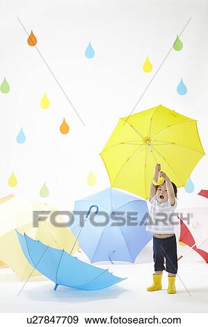 Boy Surrounded by Umbrellas in Rain View Large Photo Image Stock Photo - Boy Surrounded by Umbrellas in Rain. Fotosearch