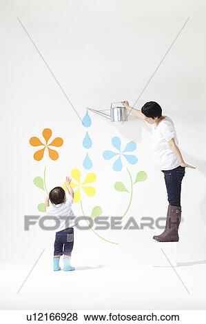 Boy Watching Mother Watering Plants View Large Photo Image Stock Photo - Boy Watching Mother Watering Plants. Fotosearch