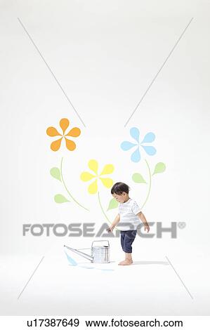 Stock Photo - Boy Watering Plants. Fotosearch
