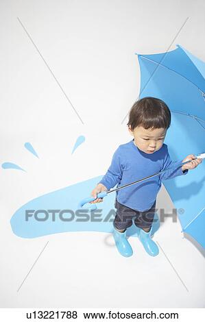 Stock Photo - Boy with an umbrella. Fotosearch