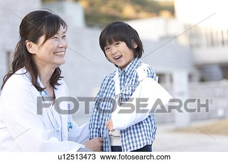 Boy with Broken Arm and Female Doctor View Large Photo Image Stock Image - Boy with Broken Arm and Female Doctor. Fotosearch
