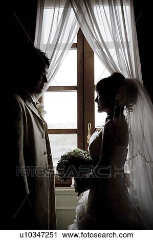 Bride and bridegroom standing face to face View Large Photo Image Stock Image - Bride and bridegroom standing face to face. Fotosearch