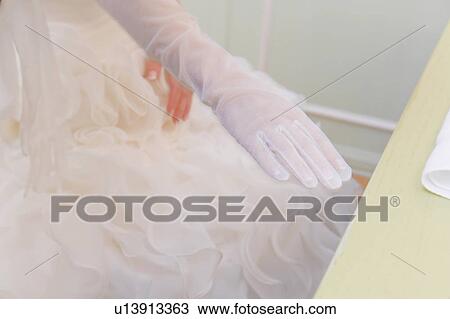 Bride wearing a glove View Large Photo Image Stock Image - Bride wearing a glove . Fotosearch