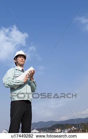 Stock Image - Businessman at Construction Site. Fotosearch