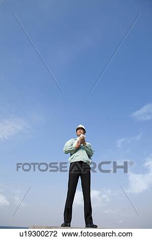 Stock Image - Businessman at Construction Site. Fotosearch