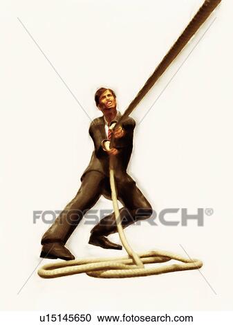 Stock Image - Businessman pulling a rope. Fotosearch