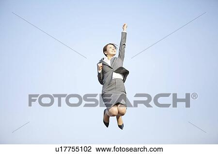 Stock Image - Businesswoman Jumping With Joy. Fotosearch