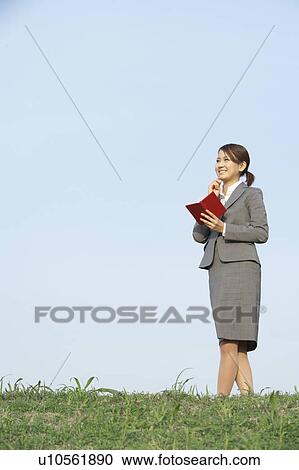 Businesswoman Making Notes in Field View Large Photo Image Stock Image - Businesswoman Making Notes in Field. Fotosearch