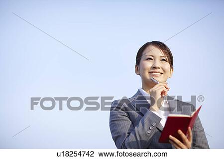 Businesswoman Making Notes View Large Photo Image Stock Image - Businesswoman Making Notes. Fotosearch