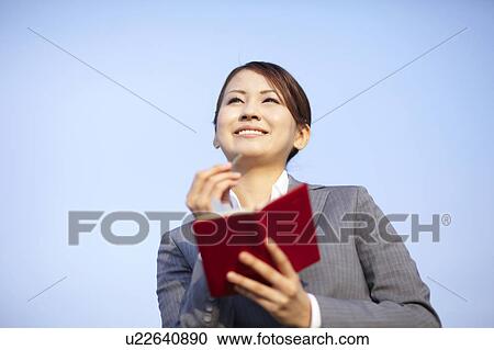 Businesswoman Making Notes View Large Photo Image Stock Image - Businesswoman Making Notes. Fotosearch
