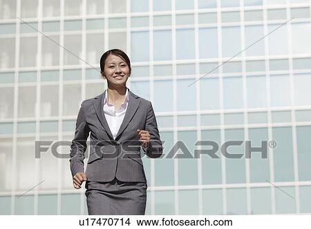 Businesswoman On The Go View Large Photo Image Picture - Businesswoman On The Go. Fotosearch