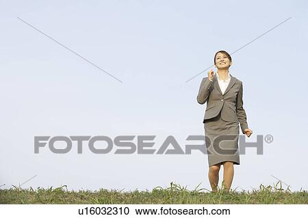 Businesswoman Running in Field View Large Photo Image Stock Image - Businesswoman Running in Field. Fotosearch