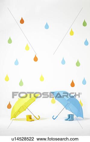 Colourful Raindrops Falling on Umbrellas and Rubber Boots View Large Photo Image Stock Image - Colourful Raindrops Falling on Umbrellas and Rubber Boots. Fotosearch