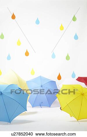 Colourful Raindrops Falling on Umbrellas View Large Photo Image Stock Image - Colourful Raindrops Falling on Umbrellas. Fotosearch