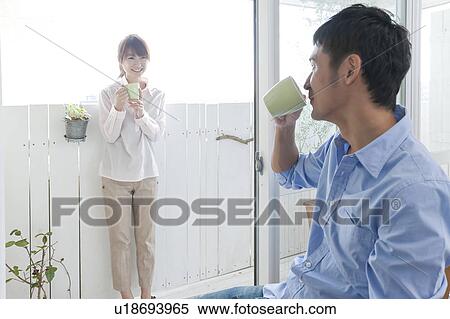 Couple talking and drinking coffee View Large Photo Image Stock Photography - Couple talking and drinking coffee. Fotosearch