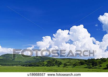 Stock Photo - Cumulus Clouds Over Landscape. Fotosearch