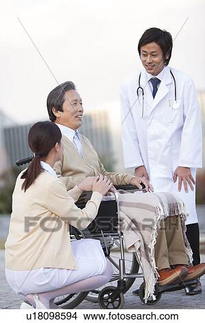 Doctor, Nurse and Male Patient View Large Photo Image Picture - Doctor, Nurse and Male Patient. Fotosearch