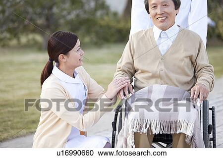Stock Image - Doctor, Nurse and Male Patient. Fotosearch