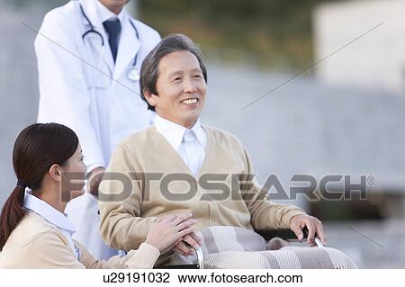 Doctor, Nurse and Male Patient View Large Photo Image Stock Image - Doctor, Nurse and Male Patient. Fotosearch