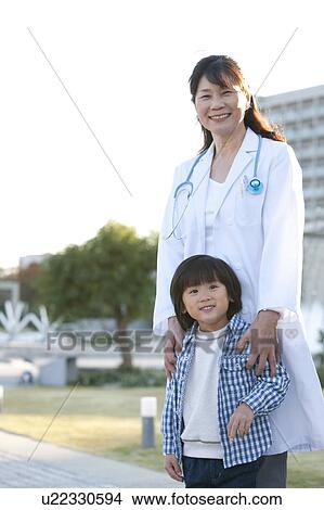 Picture - Female Doctor and Boy. Fotosearch