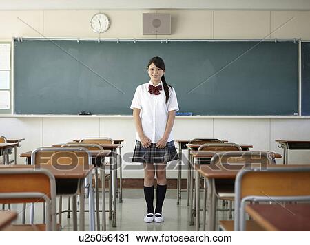 Stock Image - Female Student by Blackboard. Fotosearch