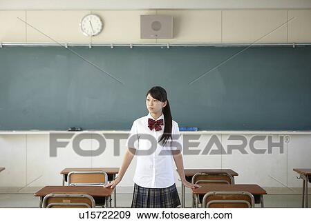 Stock Photo - Female Student by Blackboard. Fotosearch