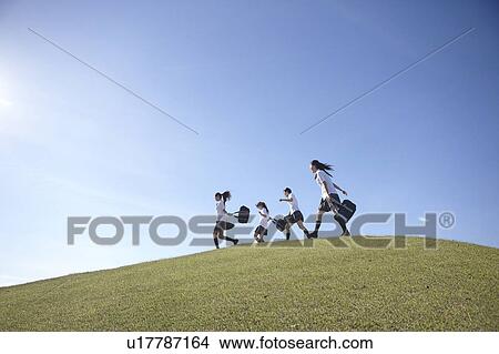 Four Schoolgirl Running on Hill View Large Photo Image Picture - Four Schoolgirl Running on Hill. Fotosearch