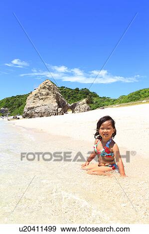 Stock Photo - Girl (3 yr) on Beach. Fotosearch