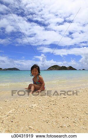 Stock Photo - Girl (3 yr) on Beach. Fotosearch