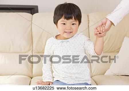 Stock Photography - Girl holding hands with mother. Fotosearch