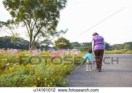 Grandmother and Grandson Walking Hand in Hand View Large Photo Image Stock Image - Grandmother and Grandson Walking Hand in Hand. Fotosearch