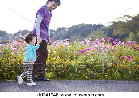 Grandmother and Grandson Walking Hand in Hand View Large Photo Image Stock Photograph - Grandmother and Grandson Walking Hand in Hand. Fotosearch