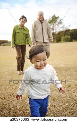 Grandparents and Grandson Walking View Large Photo Image Stock Image - Grandparents and Grandson Walking. Fotosearch