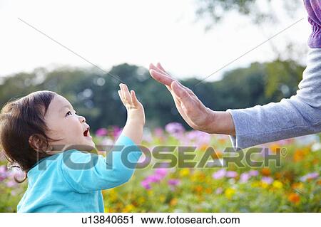 Grandson and Grandmother High Fiving View Large Photo Image Stock Image - Grandson and Grandmother High Fiving. Fotosearch