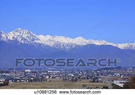 Hida mountains and cityscape, Nagano Prefecture, Honshu, Japan View Large Photo Image Stock Photograph - Hida mountains and cityscape, Nagano Prefecture, Honshu, Japan. Fotosearch