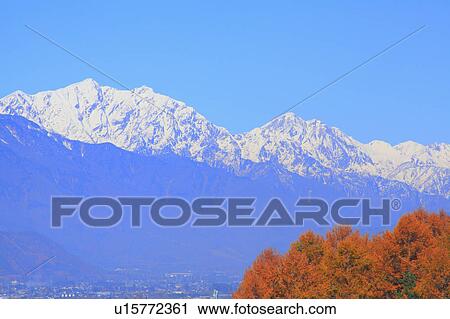 Stock Image - Hida mountains and Japanese fall foliage, Nagano Prefecture, Honshu, Japan. Fotosearch