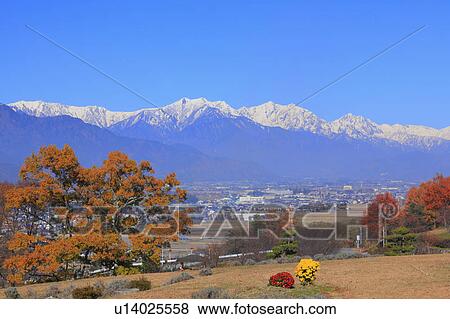 Hida mountains and Japanese fall foliage, Nagano Prefecture, Honshu, Japan View Large Photo Image Stock Photo - Hida mountains and Japanese fall foliage, Nagano Prefecture, Honshu, Japan. Fotosearch