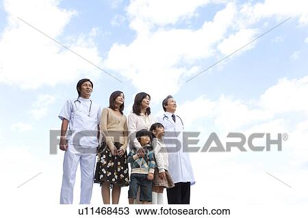 Stock Image - Hospital Staff and Patient's Family. Fotosearch