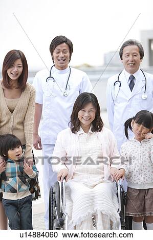 Stock Image - Hospital Staff and Patient's Family. Fotosearch