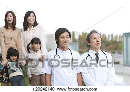 Stock Image - Hospital Staff and Patient's Family. Fotosearch