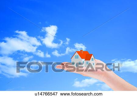 Stock Photo - House on Hand. Fotosearch