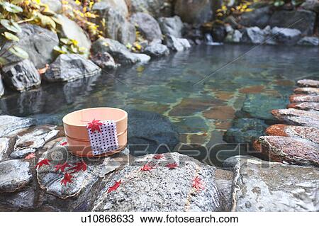 Stock Image - Japanese-style hot spring in autumn. Fotosearch