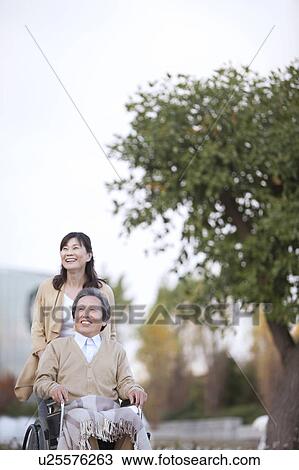Stock Image - Lifestyles, Mature Couple, Mature Woman, Japanese Ethnicity, Disabled, Family, Healthcare And Medicine. Fotosearch
